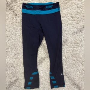 Lululemon navy blue/teal leggings. Mid-calf length